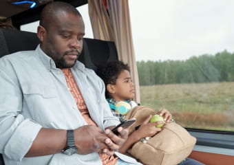Father and son on charter bus